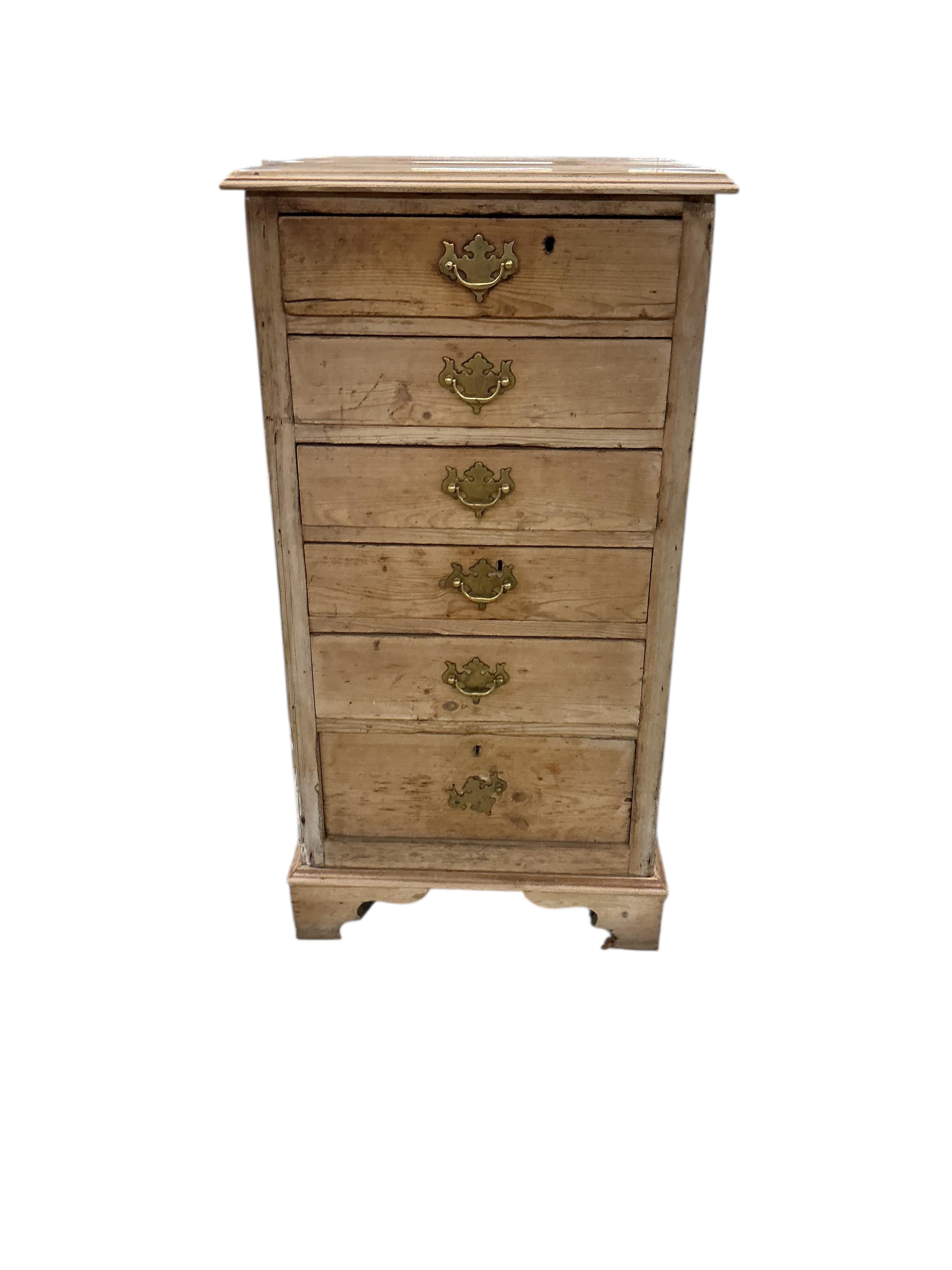 An early 19th century narrow pine chest of six drawers, width 54cm, depth 59cm, height 103cm